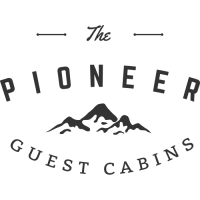 Pioneer Guest Cabins logo