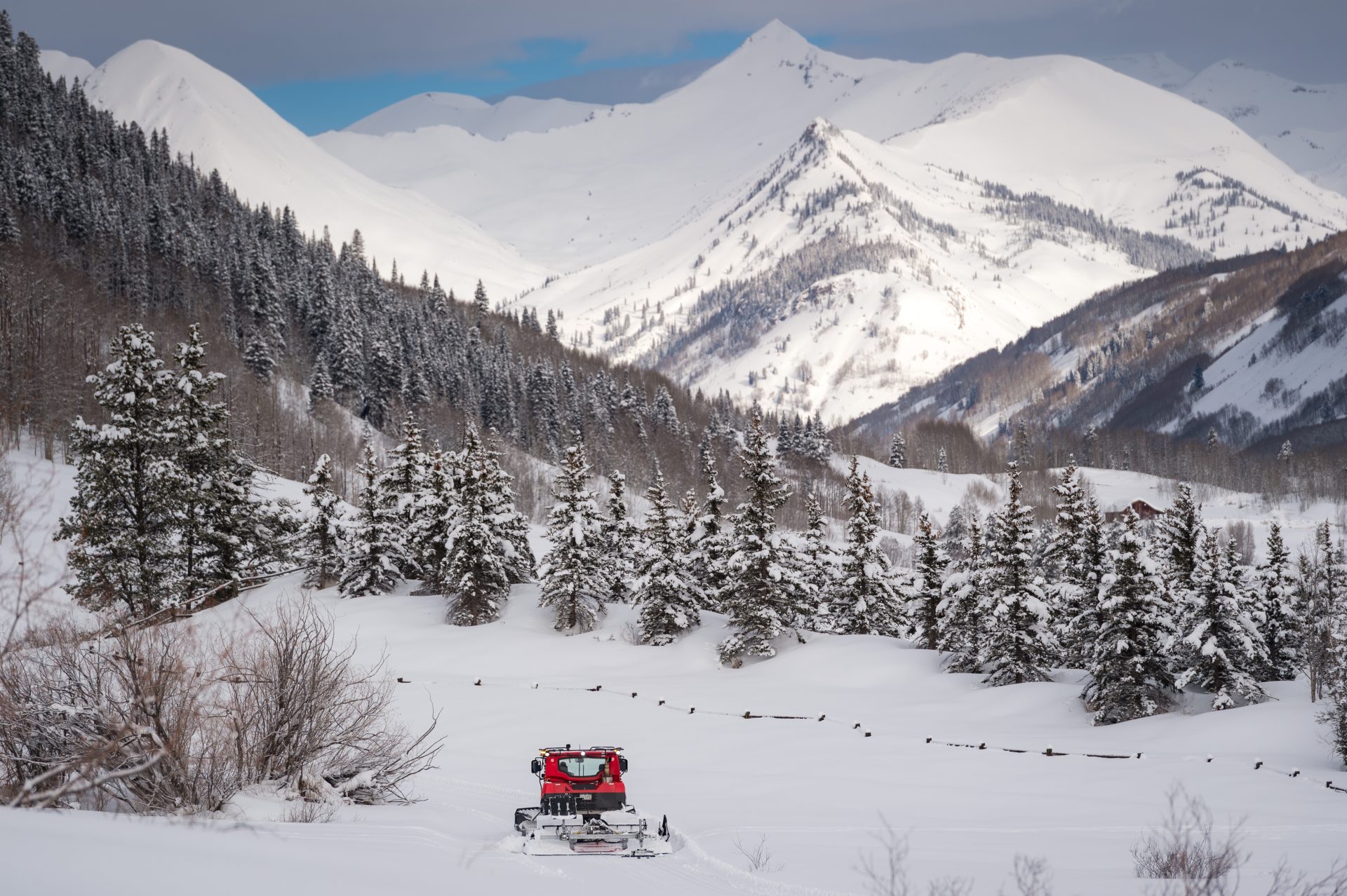 Snow cat grooming CB Nordic trails with Paradise Divide backdrop
