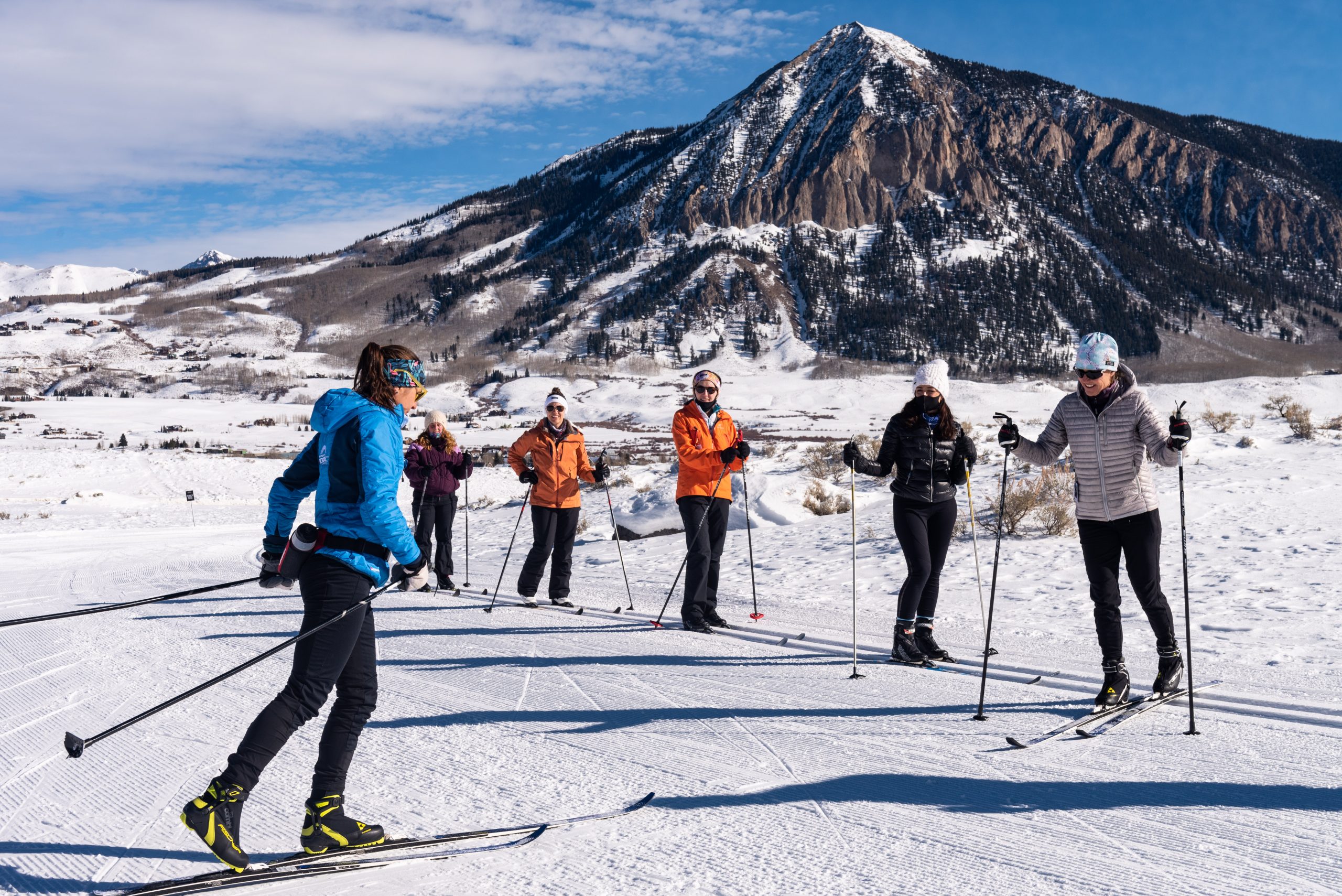 Masters ski clinic on Ruthie's Run with Mt Crested Butte in background