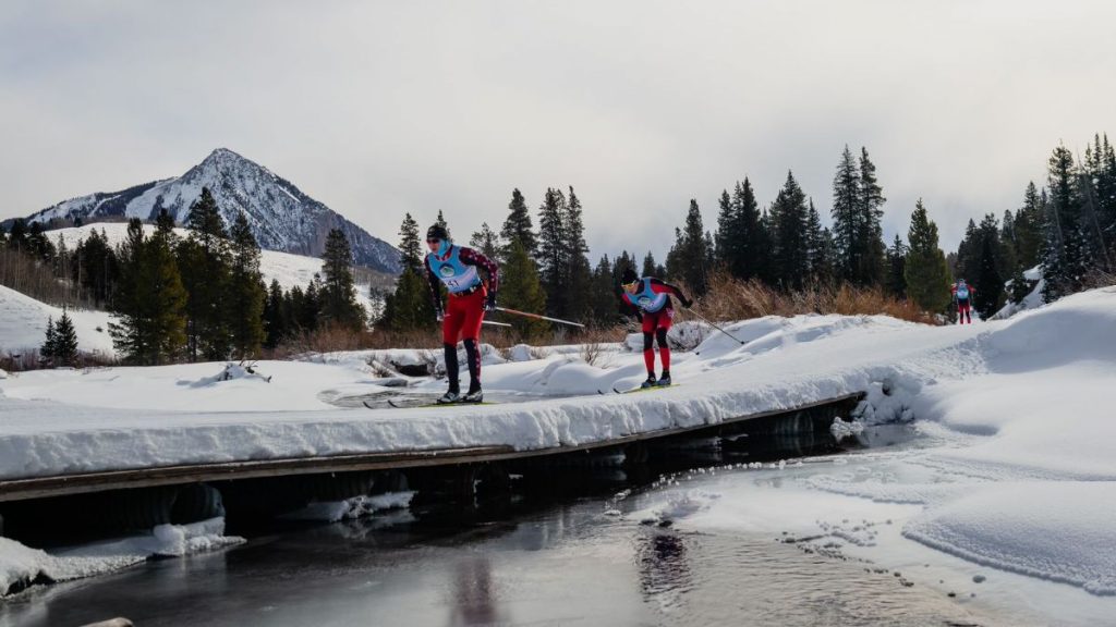 Nordic racers crossing a bridge on Mike's Mile trail near Crested Butte
