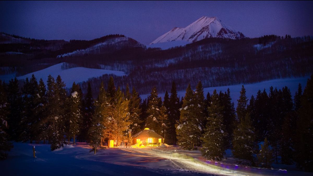Magic Meadows Yurt near Crested Butte at dusk with lights