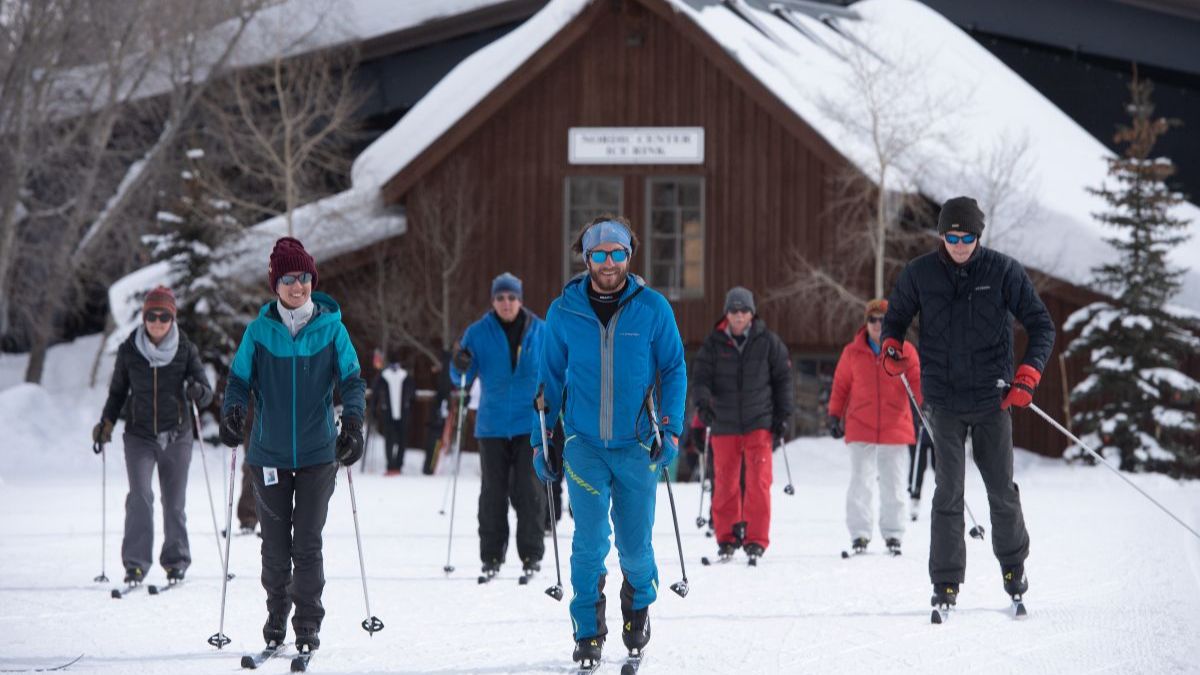 Learn to ski free participants at the warming house practice field