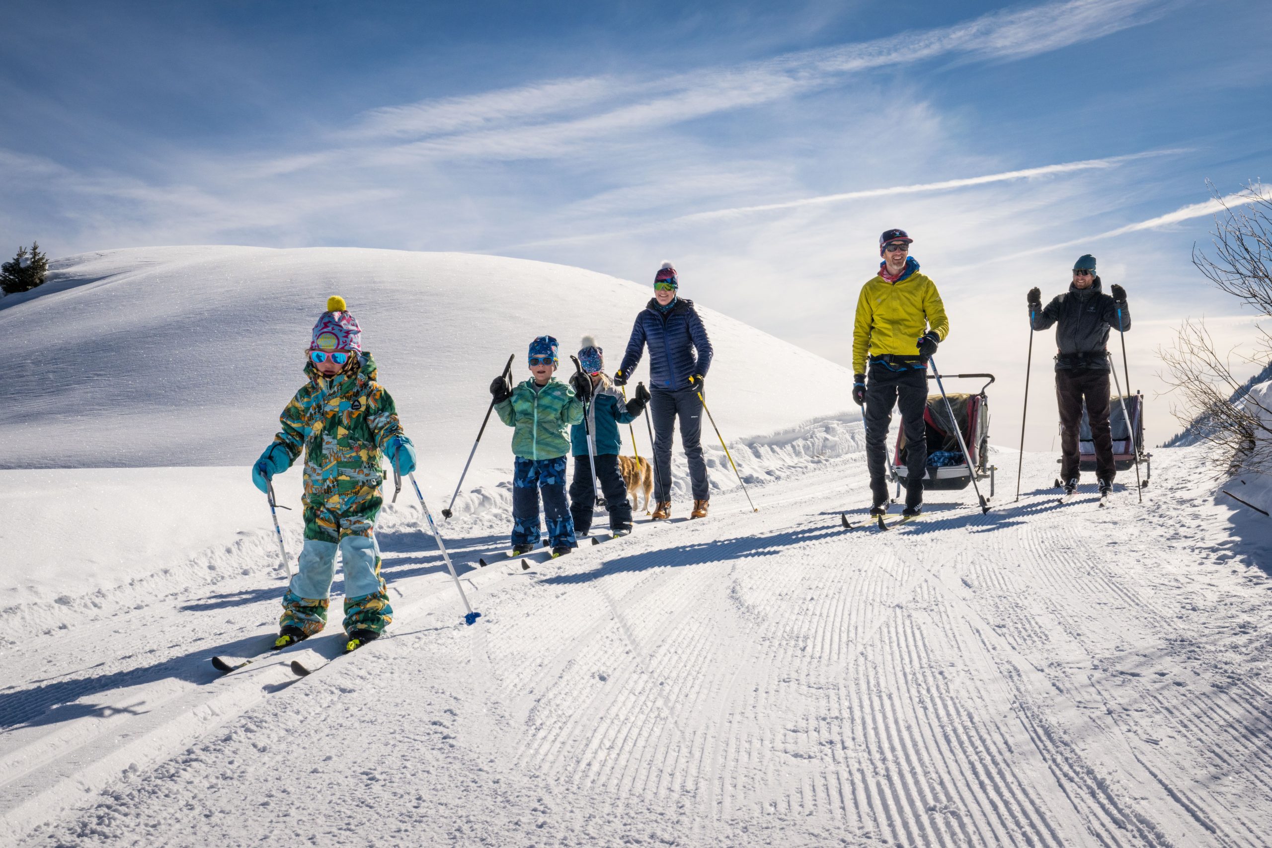 Happy family out for a ski in the sunshine near Crested Butte
