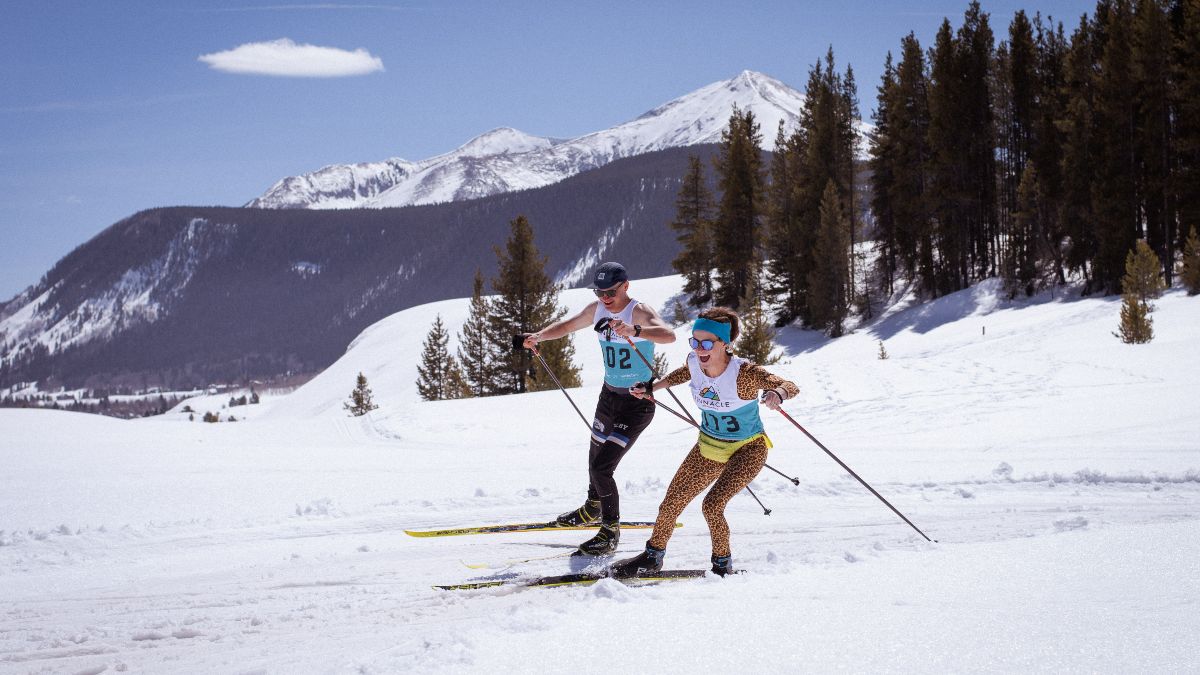 Beer Ski participants rounding a bend in a race out in the Magic Meadows trail system near Crested Butte