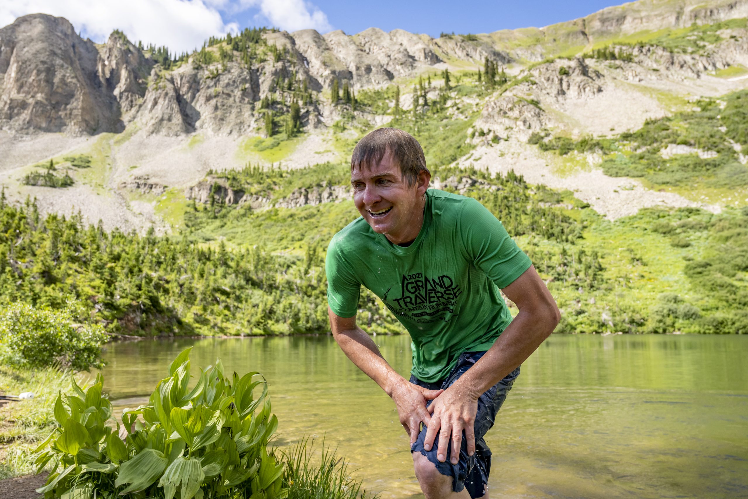 A runner emerges from Green Lake during the Grin and Bear It.